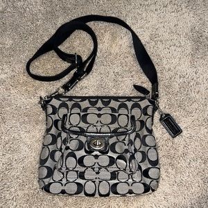 Coach purse black with adjustable strap or removable strap. Purple inside lining